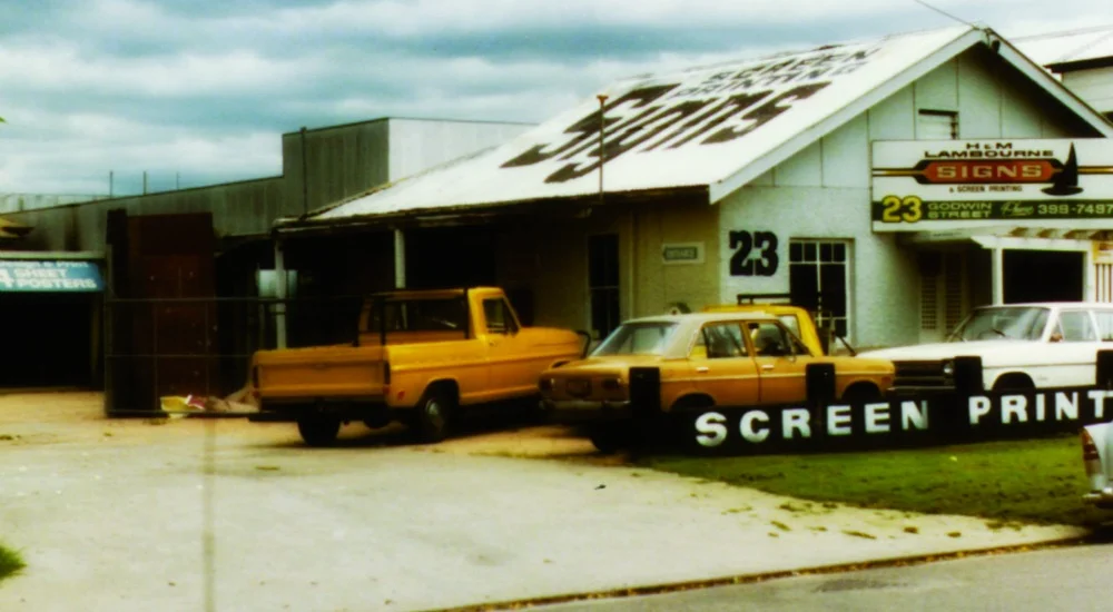 Skreenkraft - Old Building with yellow cars out front